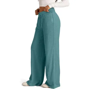 Women's solid teal wide-leg sweatpants featuring drawstring elastic waist and pockets