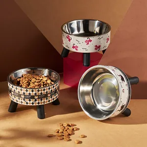 Durable stainless steel pet bowls with raised stands and various cute cat patterns.