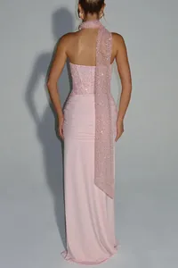 Back view of an elegant pink sequined evening dress with a matching long sash scarf