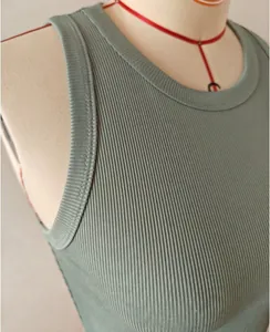 Close-up detail of sage green ribbed knit sleeveless tank top showing fabric texture
