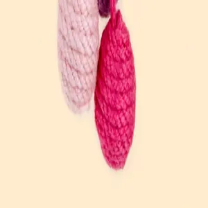 Close-up view of durable pink sisal rope cat toy balls designed for scratching