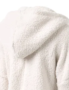 Detailed close-up showing the soft white fluffy sherpa fleece texture on a hooded jacket