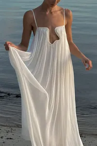 Elegant white pleated spaghetti strap maxi dress with unique U-wire neckline for beach vacation