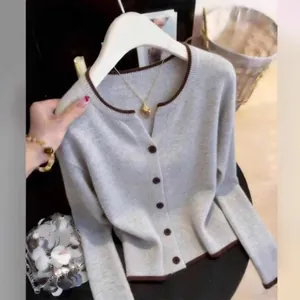 Elegant grey knit cardigan sweater coat with brown contrast trim and brown buttons