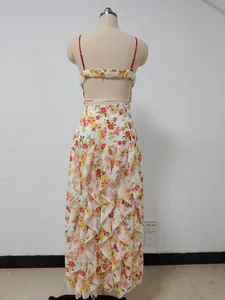 Back view of a floral print chiffon maxi dress with tiered ruffles and thin red straps.