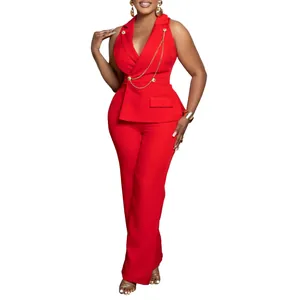 Elegant red sleeveless blazer collar jumpsuit with chic gold chain and wide leg cut