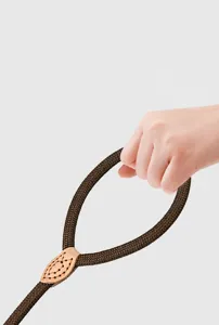 Close-up detail showing the high-density polyester braided texture of a brown pet P-rope leash