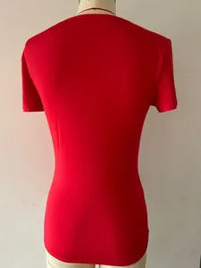 Back view of a vibrant red slim-fit short sleeve bodysuit on a white mannequin setup.