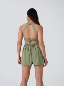 Women's sleeveless green romper with open-back twist detail and elastic waist