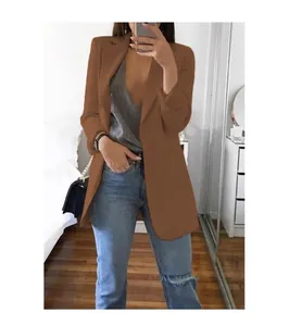 Brown slim fit blazer jacket with lapel collar paired with ripped jeans for a casual look