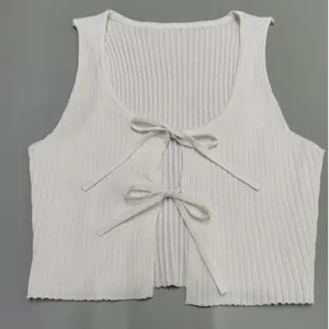 White rib-knit crop top featuring a front tie design and sleeveless silhouette