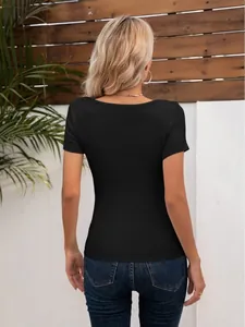 Back view of a slim fit black short sleeve t-shirt for women in an outdoor setting