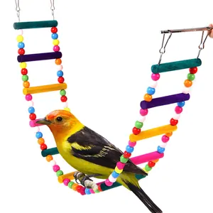 Detail view of a colorful wooden bird ladder swing with a yellow parrot perched on it