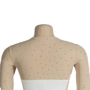 Close-up detail of beige mesh dress with silver rhinestone embellishments on the back.