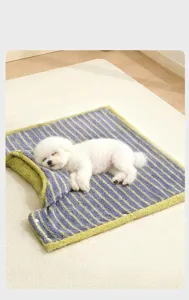 Detail of soft striped pet cloak used as a cozy sleeping mat for small dogs