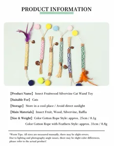 Close-up detail of natural Matatabi cat chew sticks with colorful raffia and feathers