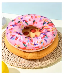 Close-up view of pink donut and pizza themed plush squeaky dog toys with crinkle paper