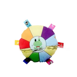 Colorful plush squeaky frisbee dog toy with cute cartoon frog design and multi-color ribbon tags