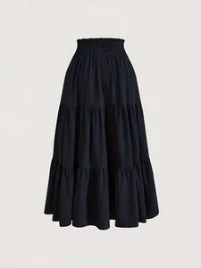 Detailed view of black tiered plus size cake skirt with elastic high waist.