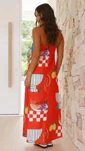 Back view of red strapless maxi dress featuring vibrant fruit and checkerboard prints