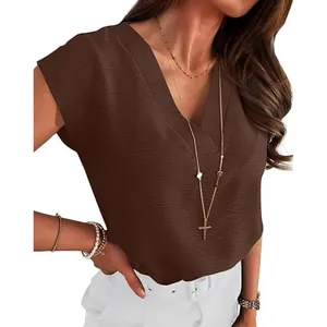 Detailed view of the brown V-neck blouse showing textured fabric and elegant fit