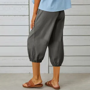 Back view of women's casual grey cropped cotton linen pants with elastic cuffs