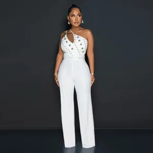 Elegant white one-shoulder jumpsuit featuring gold stud embellishments and waist belt detail