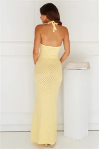 Back view of yellow knitted halter maxi beach dress with diamond pattern detail