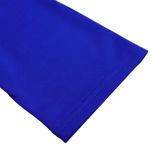 Close-up detail of the double-stitched hem on a vibrant royal blue dress fabric