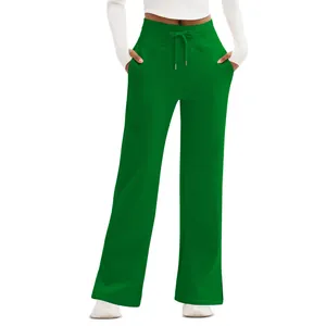 Detailed view of ladies green high-waist wide-leg pants with a drawstring waist