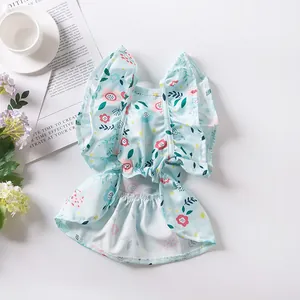 Close-up detail of a light blue floral pet dress with ruffled sleeves for small dogs