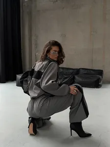 European style grey and black color-block sports tracksuit for women in industrial studio