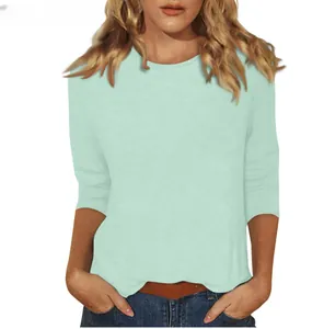 Close-up of a women's mint green 3/4 sleeve round neck T-shirt in a soft cotton fabric