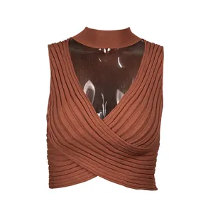 Detail view of brown knitted halter neck cropped tank top with cross-front design