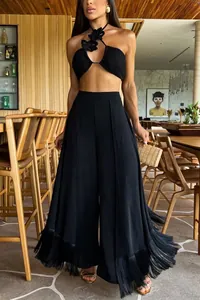 Elegant black flared trousers featuring stylish fringe trim at the hem for a chic look.