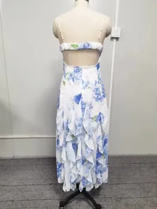 Detailed back view of white chiffon maxi dress featuring blue floral print and elegant ruffles