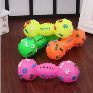 Multi-colored squeaky dumbbell pet toy for dogs featuring durable paw and bone relief patterns