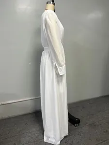 Side view of a white double-layer chiffon maxi dress with elegant long sleeves