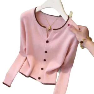 Elegant pink knit cardigan sweater for women featuring contrast brown trim and buttons