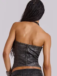 Back view of a vintage distressed PU leather corset top with zipper and lace-up details