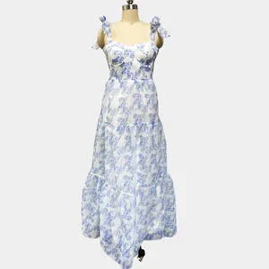 Sleeveless floral organza maxi dress with blue tie straps and tiered skirt detail