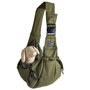 Detail view of olive green pet sling carrier with breathable mesh and utility pocket