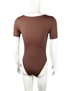 Detailed back view of brown ribbed short sleeve yoga bodysuit on white mannequin stand