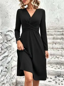 Elegant black long-sleeved V-neck midi dress featuring cross pleated waist detail