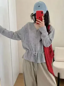 Stylish grey hollow-out knit cardigan with waist drawstring shown in mirror selfie