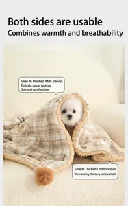 Detail showing the reversible soft milk velvet and cotton fleece textures of the pet blanket.