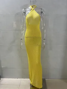 Detailed close-up of vibrant yellow diamond-patterned knit halter beach cover-up maxi dress