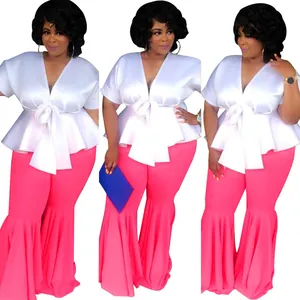 Sexy white V-neck peplum top paired with bright pink ruffled flare leg pants set