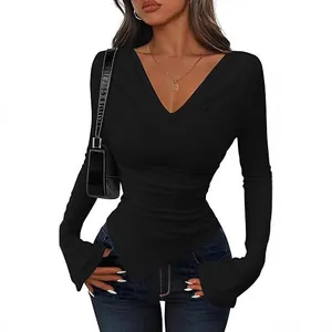 Elegant black long-sleeved slim-fit top featuring an asymmetrical hem and deep V-neckline