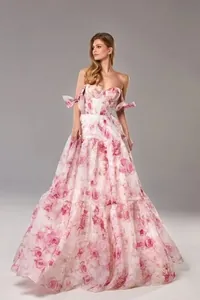 Full-body detail of pink floral organza evening gown showing off-shoulder tiered skirt design